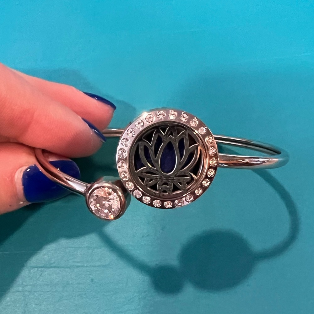 Silver and faux diamond accented essent oil bracelet.